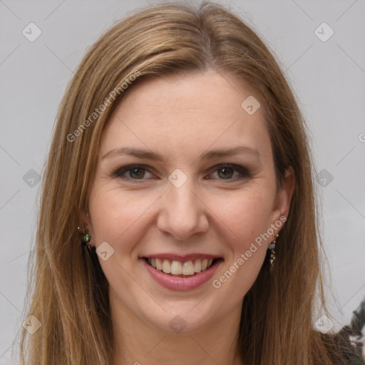 Joyful white young-adult female with long  brown hair and green eyes