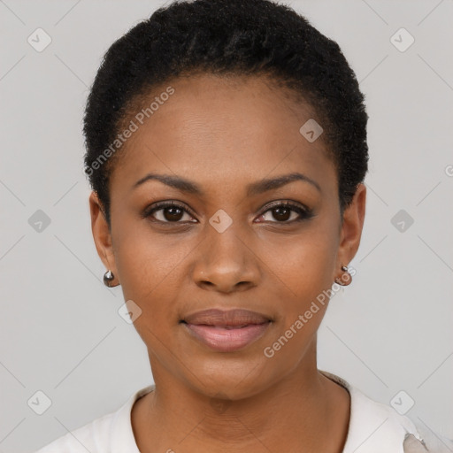 Joyful black young-adult female with short  black hair and brown eyes