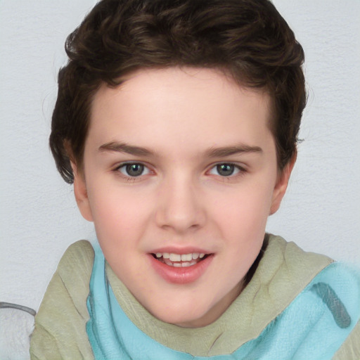 Joyful white child female with short  brown hair and blue eyes