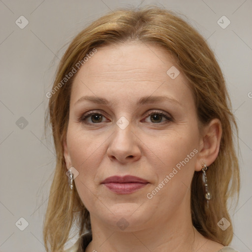 Joyful white adult female with medium  brown hair and brown eyes