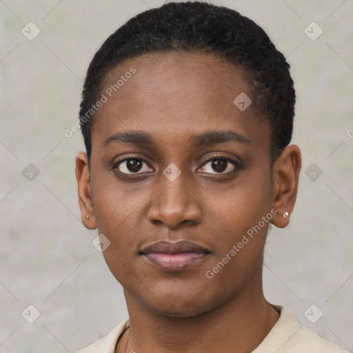 Joyful black young-adult female with short  black hair and brown eyes