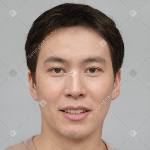 Joyful asian young-adult male with short  brown hair and brown eyes