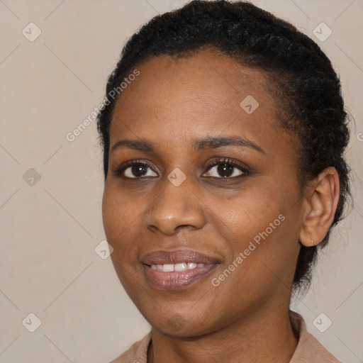 Joyful black young-adult female with medium  black hair and brown eyes