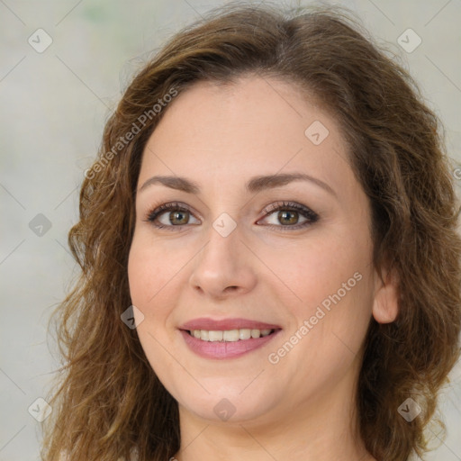 Joyful white young-adult female with medium  brown hair and green eyes