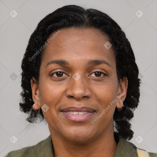 Joyful black adult female with short  brown hair and brown eyes