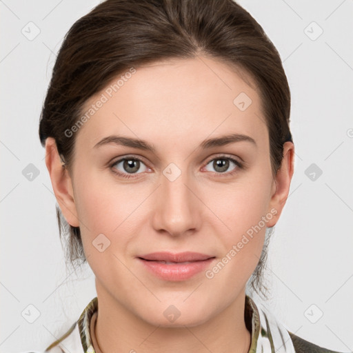 Joyful white young-adult female with medium  brown hair and grey eyes