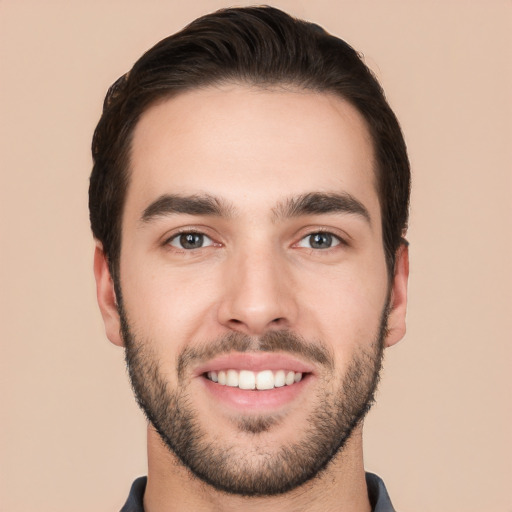 Joyful white young-adult male with short  black hair and brown eyes