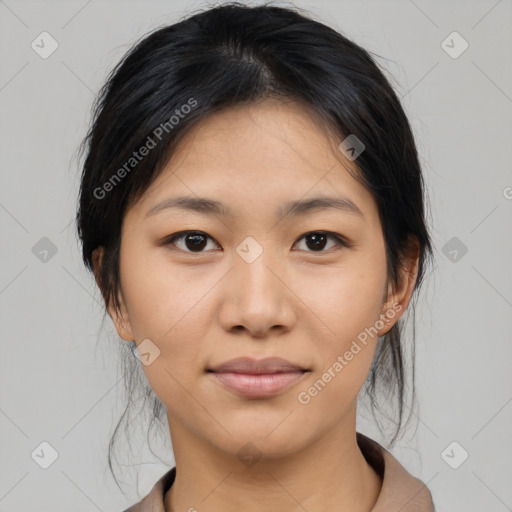 Joyful asian young-adult female with medium  black hair and brown eyes