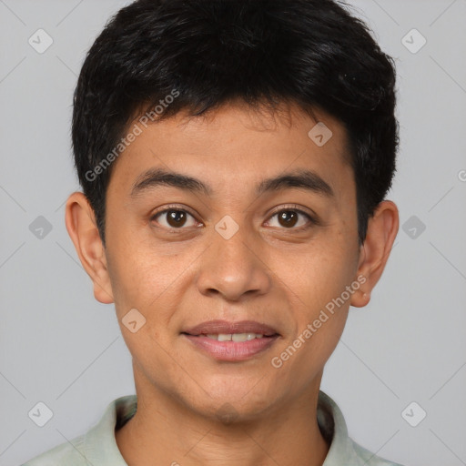 Joyful asian young-adult male with short  brown hair and brown eyes