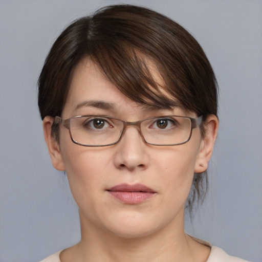 Joyful white young-adult female with medium  brown hair and grey eyes