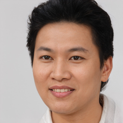 Joyful asian young-adult female with short  brown hair and brown eyes