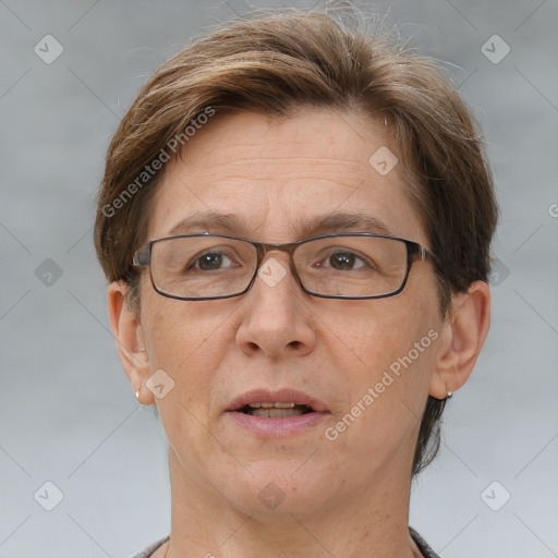 Joyful white adult female with short  brown hair and brown eyes