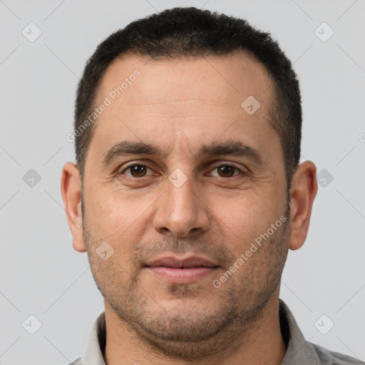 Joyful white adult male with short  brown hair and brown eyes