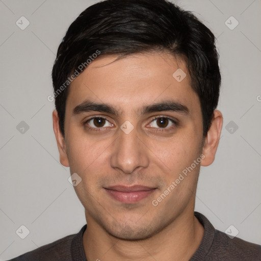 Joyful white young-adult male with short  black hair and brown eyes