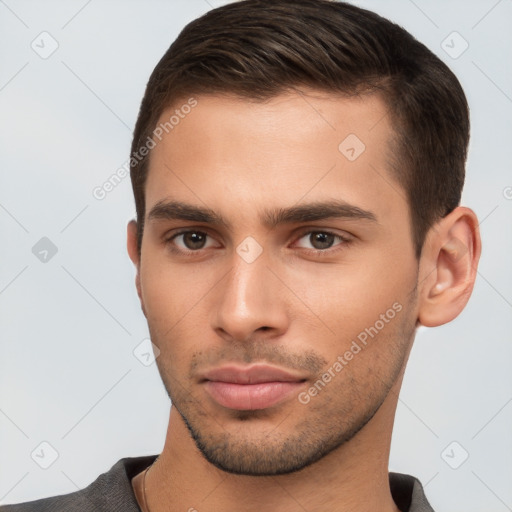 Neutral white young-adult male with short  brown hair and brown eyes