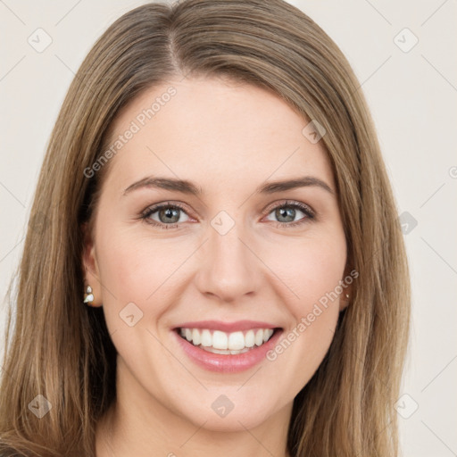 Joyful white young-adult female with long  brown hair and green eyes