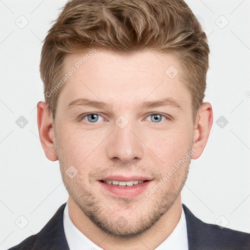 Joyful white young-adult male with short  brown hair and blue eyes