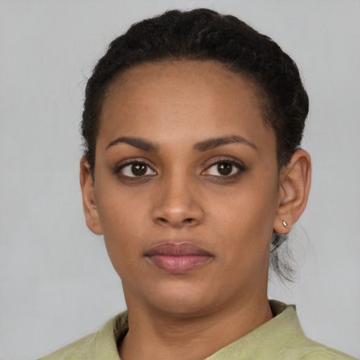 Neutral black young-adult female with short  black hair and brown eyes
