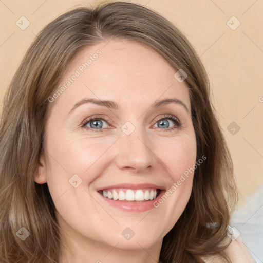 Joyful white young-adult female with long  brown hair and green eyes