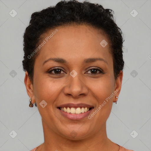Joyful black adult female with short  brown hair and brown eyes