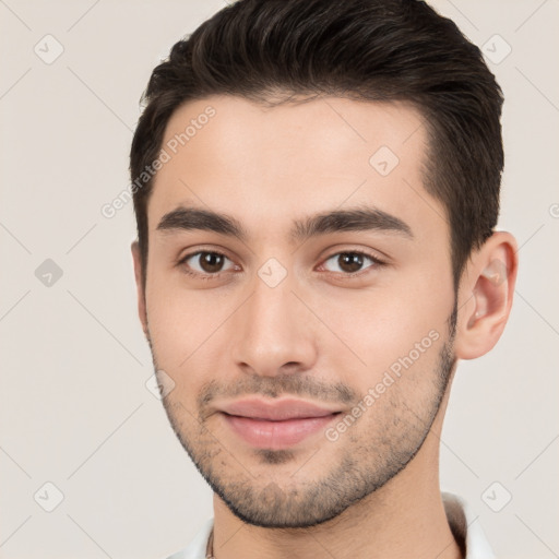 Joyful white young-adult male with short  brown hair and brown eyes