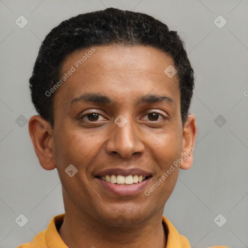 Joyful latino young-adult male with short  black hair and brown eyes