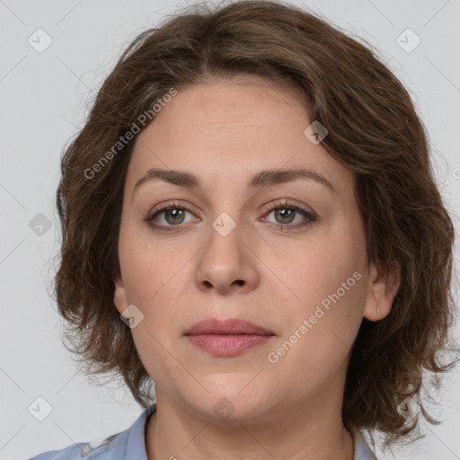 Joyful white young-adult female with medium  brown hair and green eyes