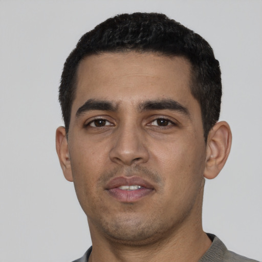 Neutral latino young-adult male with short  black hair and brown eyes