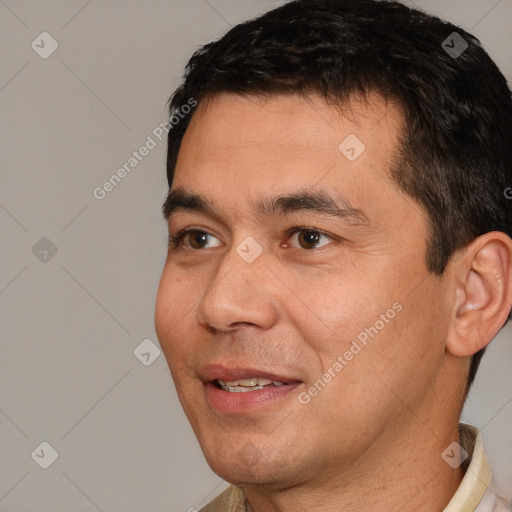 Joyful white adult male with short  black hair and brown eyes