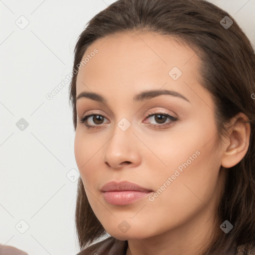 Neutral white young-adult female with long  brown hair and brown eyes