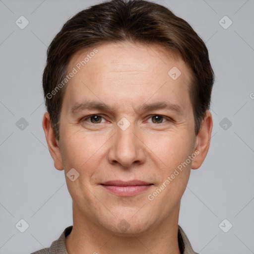 Joyful white adult male with short  brown hair and grey eyes