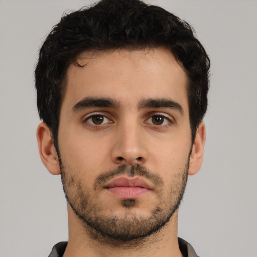 Neutral latino young-adult male with short  black hair and brown eyes