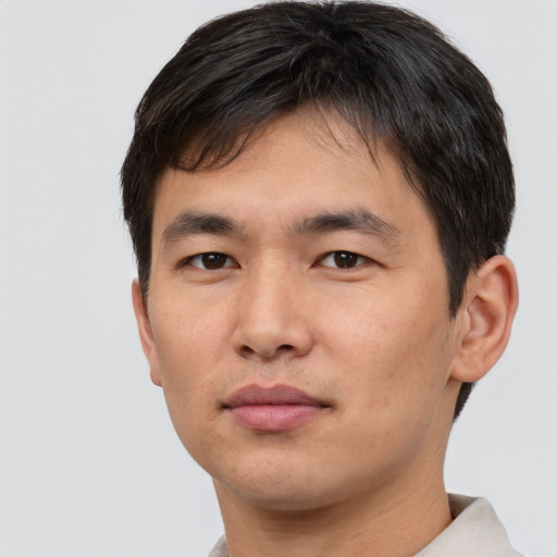 Neutral asian young-adult male with short  brown hair and brown eyes