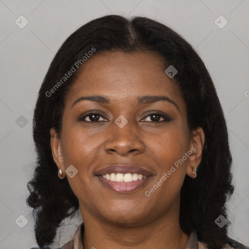 Joyful black young-adult female with medium  brown hair and brown eyes