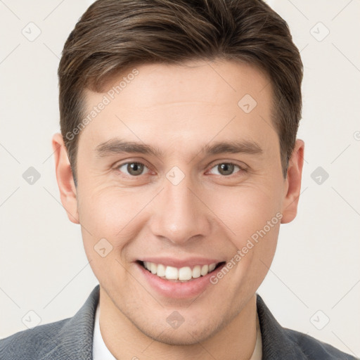 Joyful white young-adult male with short  brown hair and brown eyes