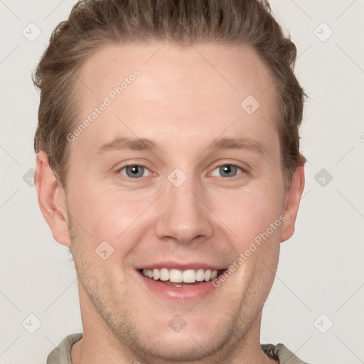 Joyful white adult male with short  brown hair and grey eyes