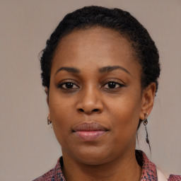 Neutral black young-adult female with medium  black hair and brown eyes