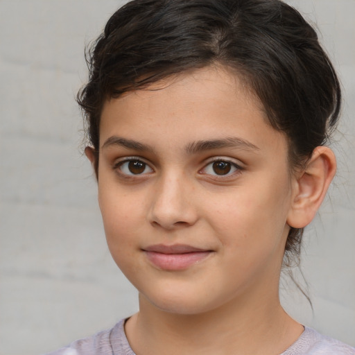 Joyful white child female with medium  brown hair and brown eyes