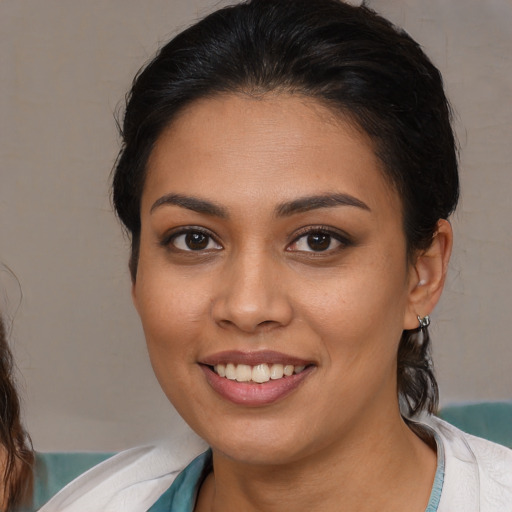 Joyful white young-adult female with medium  brown hair and brown eyes