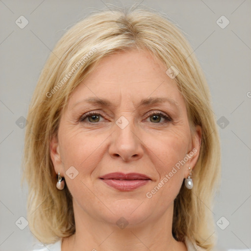 Joyful white adult female with medium  brown hair and blue eyes