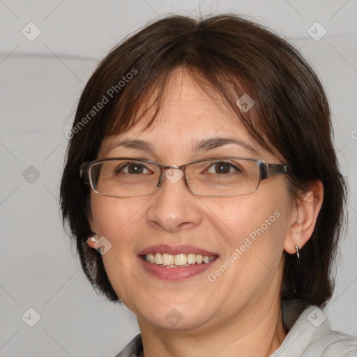 Joyful white adult female with medium  brown hair and brown eyes