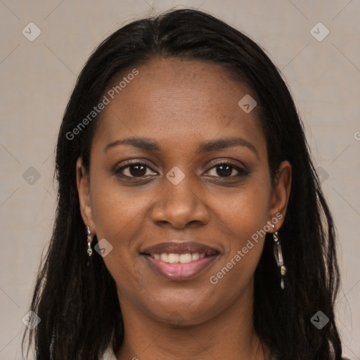 Joyful black young-adult female with long  brown hair and brown eyes