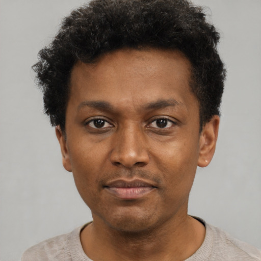 Neutral black young-adult male with short  black hair and brown eyes