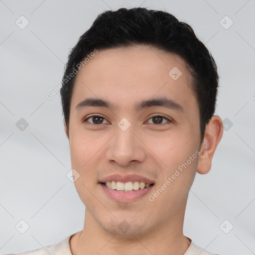 Joyful white young-adult male with short  black hair and brown eyes