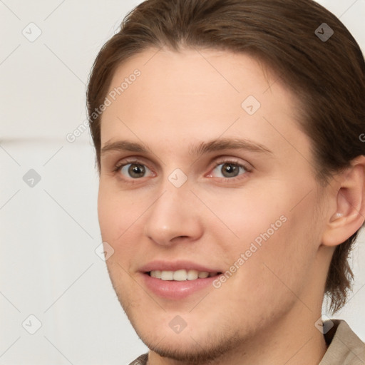 Joyful white young-adult female with short  brown hair and brown eyes