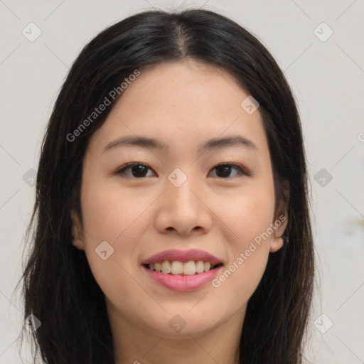 Joyful asian young-adult female with long  brown hair and brown eyes