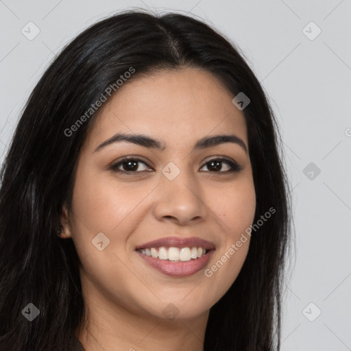 Joyful latino young-adult female with long  brown hair and brown eyes