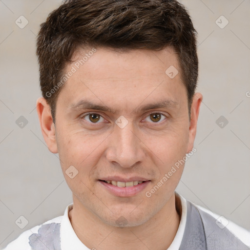 Joyful white adult male with short  brown hair and brown eyes