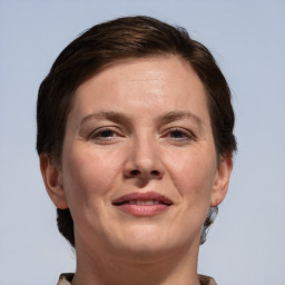 Joyful white adult female with short  brown hair and brown eyes