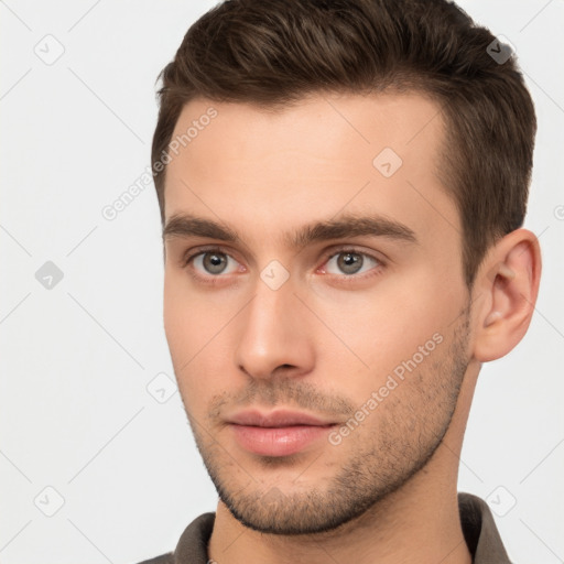 Neutral white young-adult male with short  brown hair and brown eyes